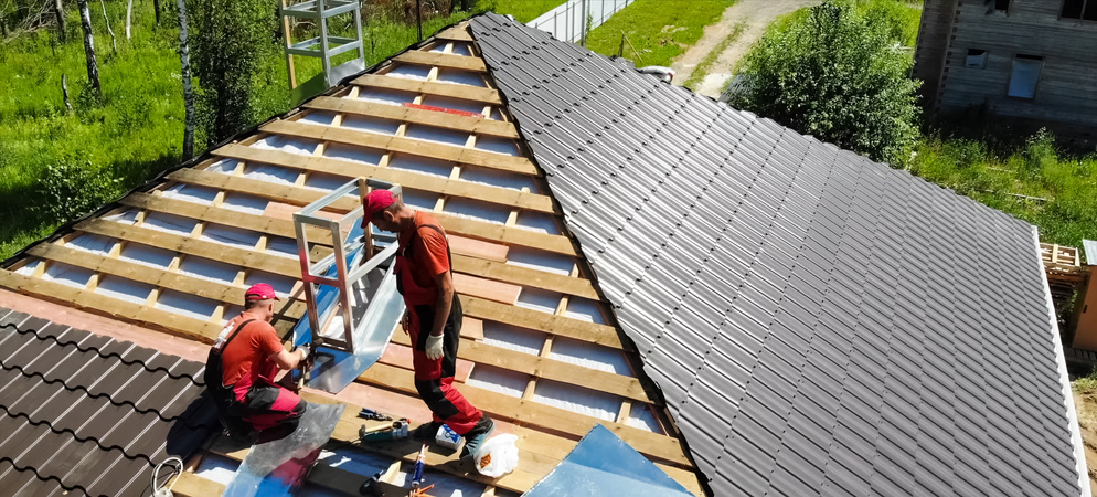 Workers Installing Roofing Material